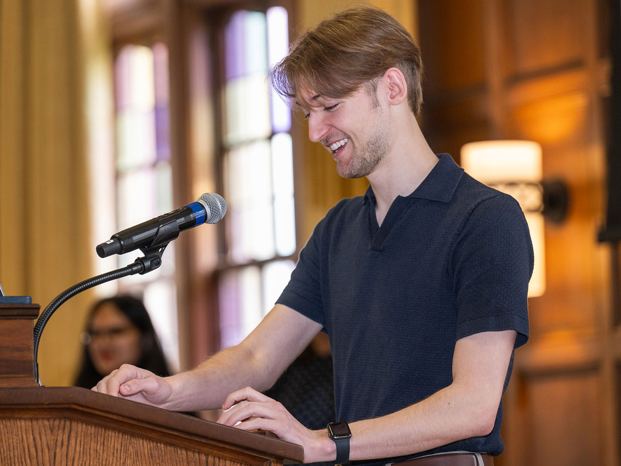 Student speaks from a podium