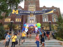 Michigan Union with "Welcome to Michigan" banner and balloons