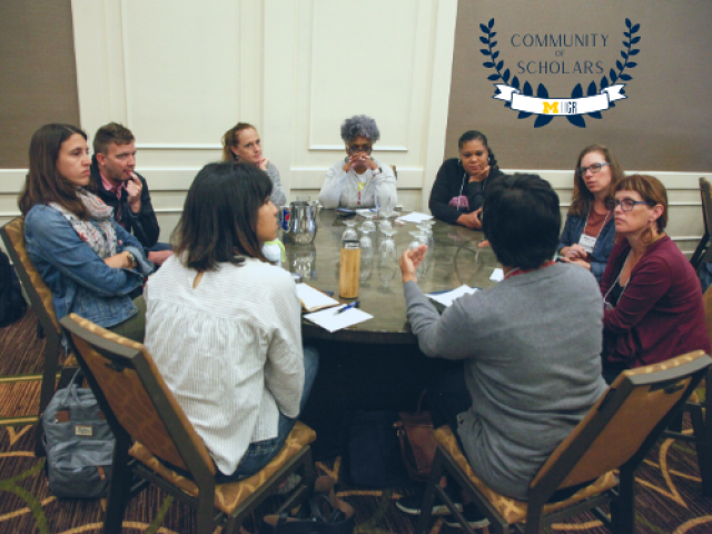 Staff seated around a table