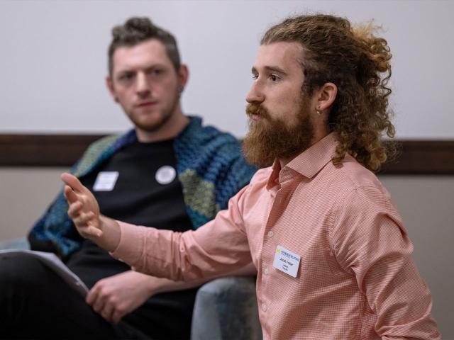 Jacob Foster speaks to faculty and staff in a small group session