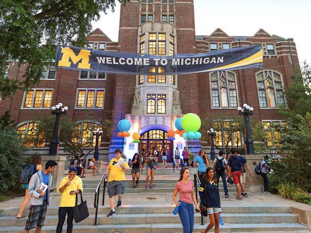 Michigan Union with "Welcome to Michigan" banner and balloons